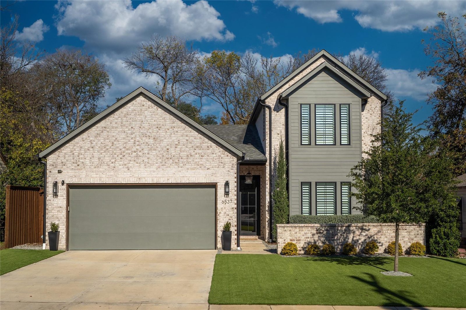 Brick and olive-trimmed two-story house on Trammel Drive